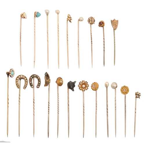 206 - A collection of Victorian and early 20th c gold stickpins, a labradorite terminal of one carved as t... 