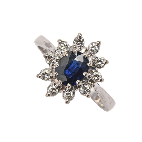 241 - A sapphire and diamond cluster ring, in white gold marked 18ct, 4.5g, size J