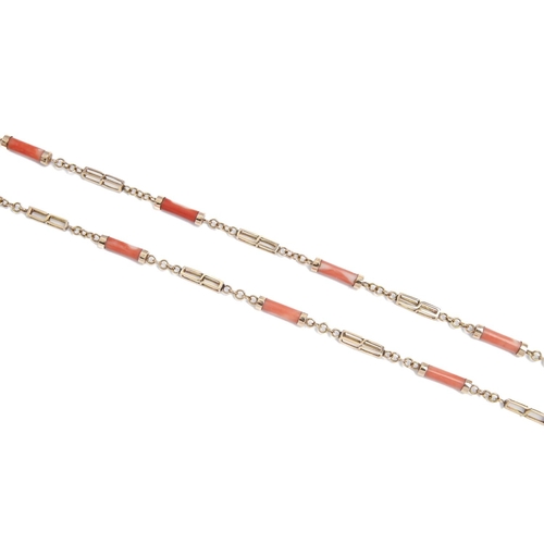 266 - A gold and coral baton necklace, 80cm l, marked 14k, 22.1g