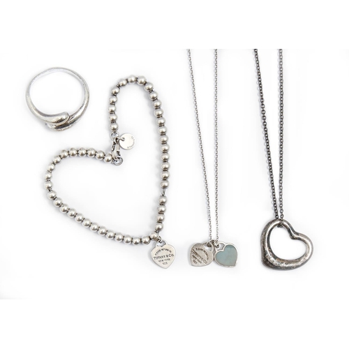 279 - Tiffany & Co. A silver ring, heart shaped pendant, bead bracelet and necklet, maker's marks, 23g... 