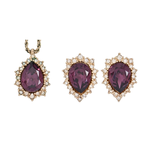 291 - Costume jewellery. Christian Dior - a white and purple drop shaped glass and gold plated pendant, ch... 