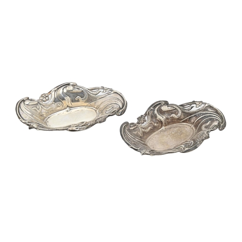 325 - A pair of Edwardian Art Nouveau die stamped silver bonbon dishes, 15cm l, by C T Burrows & Sons,... 