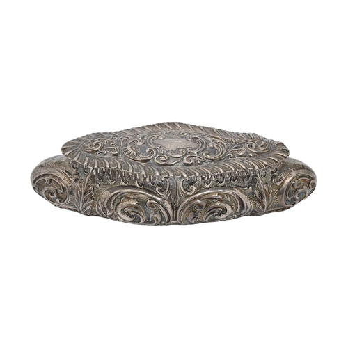 327 - An Edwardian silver trinket box, the lid and sides die stamped with scrolls in gadrooned border, 16.... 