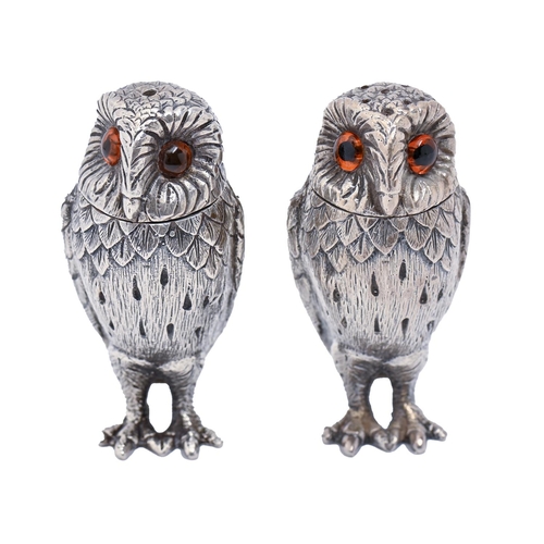 419 - A pair of Elizabeth II cast silver owl novelty condiments, 72mm h, by William Comyns & Sons Ltd,... 