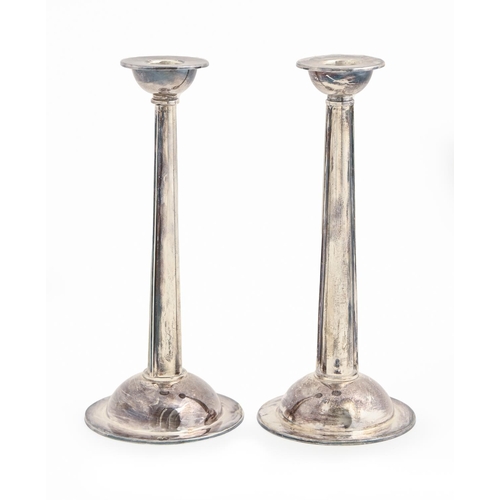 444 - Martyn Pugh. A pair of Elizabeth II silver 'curve' candlesticks, the foot engraved with the Sun, 21c... 