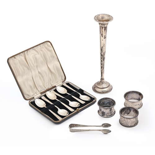 498 - Three Edwardian and later silver napkin rings, a cased set of six silver coffee spoons, Sheffield 19... 