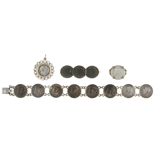 603 - A Victorian silver coin bracelet, a similar brooch, ring and pendant, 17dwts