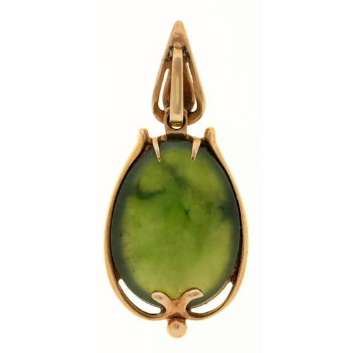 65 - A nephrite pendant, early 20th c, in gold, 39mm, marked 9ct, 5.4g