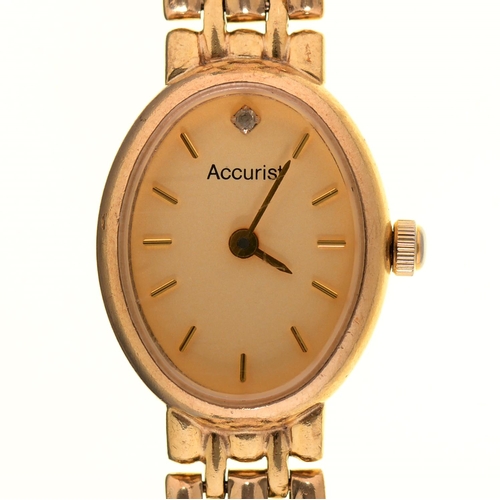 69 - An Accurist gold oval lady's wristwatch, quartz movement, 15 x 19mm, on a gold bracelet marked 9ct, ... 