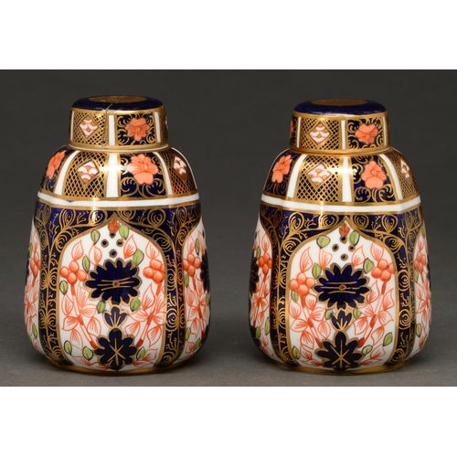 694 - A pair of Royal Crown Derby Imari pattern sack shaped jars and covers, 1921 and 1922, 10cm h, printe... 