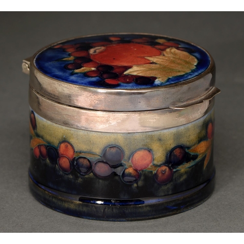 708 - A Moorcroft Pomegranate lidded box, c1930, with silver plated mount, 90mm diam, impressed marks... 