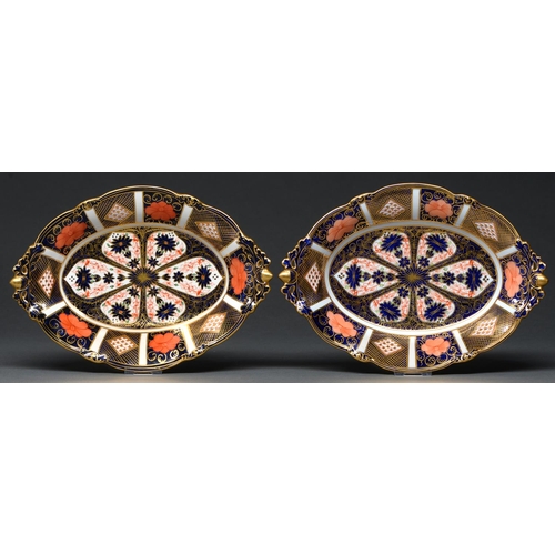 712 - A pair of Royal Crown Derby fruit dishes, 1940, with pierced acorn handles and feet, 29cm l, printed... 