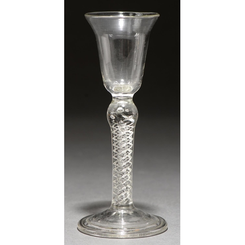 736 - A wine glass, mid 19th c,  ? sodametal, the flared, round funnel bowl on double series air twist ste... 