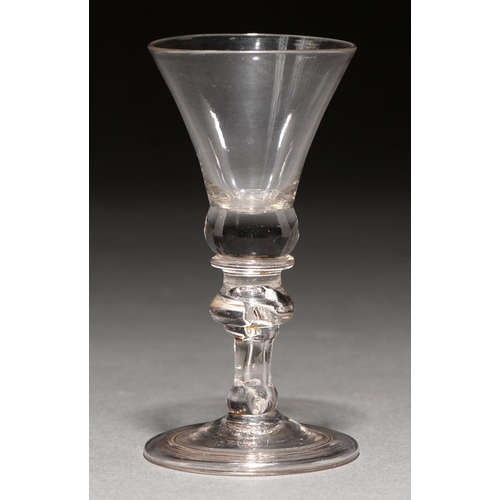 737 - A wine glass, mid 18th c,  the thistle bowl on inverted baluster stem and folded foot, 13.3cm... 