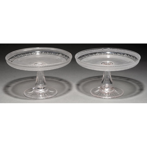 770 - A pair of Victorian semi frosted and wheel engraved glass tazze, on star cut foot, 23cm diam... 