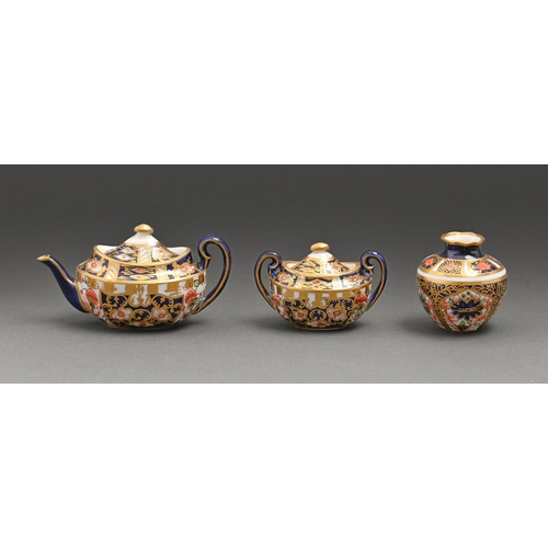 788 - A Royal Crown Derby Witches pattern miniature teapot and cover, sugar bowl and cover, 1908, teapot a... 