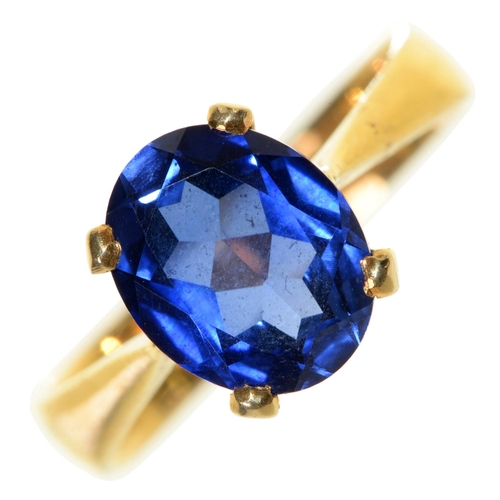 80 - A synthetic sapphire ring, in gold and associated 22ct gold hoop, Birmingham 1925, 5.8g, size Q... 