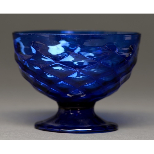 809 - An English moulded blue glass sugar bowl, late 18th c, on moulded foot, 11cm diam