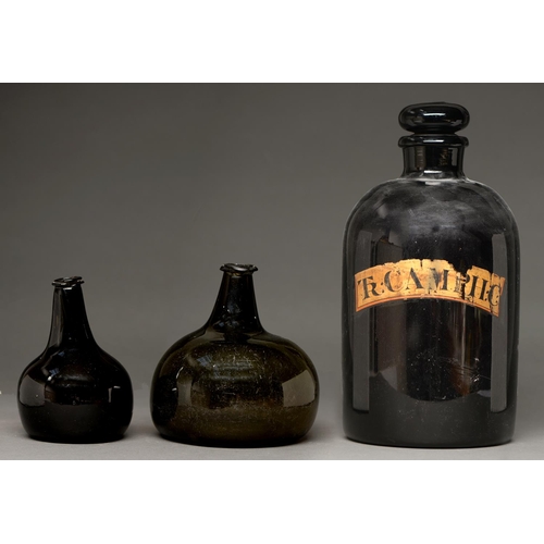 814 - Two English glass utility bottles, early 18th c,  15 and 16cm  and a druggist's labelled glass carbo... 