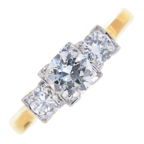 82 - A three stone diamond ring, with square set round brilliant cut diamonds, gold hoop marked 18ct &... 