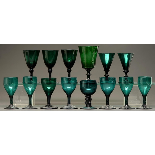 821 - A green glass goblet, c1830,  the bucket bowl on waisted stem with bladed knop and flared foot, 15.5... 