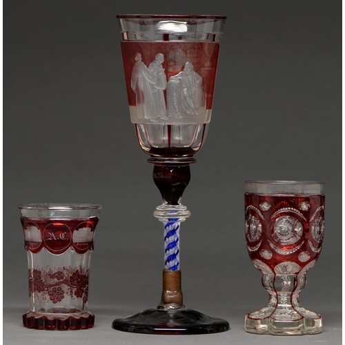 824 - A Bohemian  glass goblet,c1860  cased in ruby glass and finely engraved with a philosopher in a cell... 