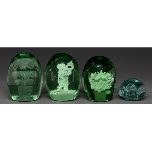 830 - Four Victorian glass dumps, one internally decorated with a boy blowing a horn, another with thistle... 