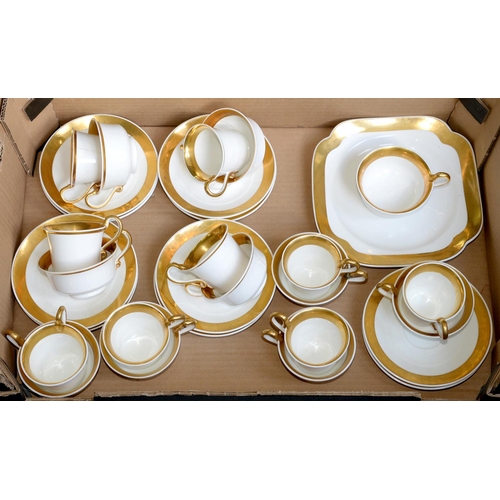 841 - A Spode white and gilt tea and coffee service, c1820,  of Etruscan shape with serpent handle, square... 