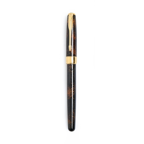 890 - A Parker tortoiseshell coloured and gold plated fountain pen, the gold nib marked 18k 750... 