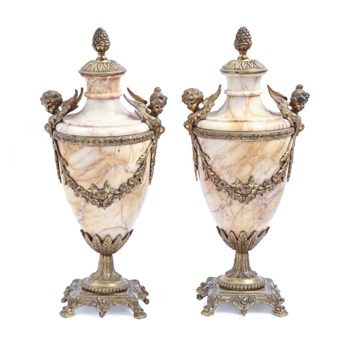 931 - A pair of French marble urns, late 19th / early 20th c, in Louis XVI style and of shield shape with ... 