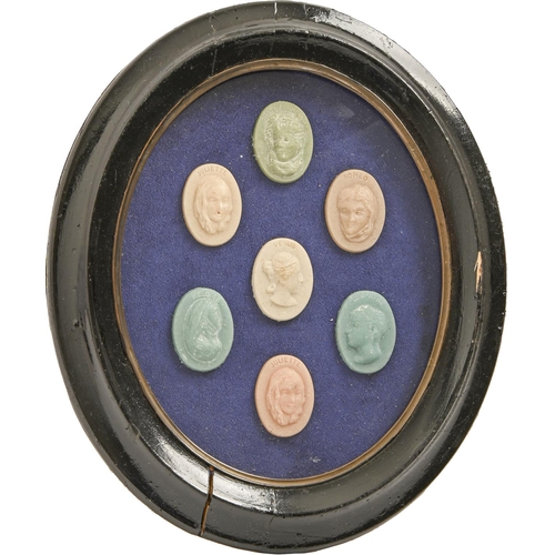 968 - A framed set of seven French wax cameos of Romeo, Juliet (2), Venus, Heloise and Cleopatra, oval bla... 