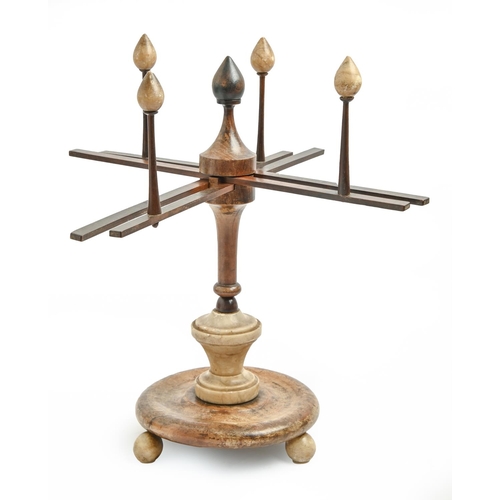 973 - A French turned wood and alabaster wool winder, 19th c, on three feet, 37cm h