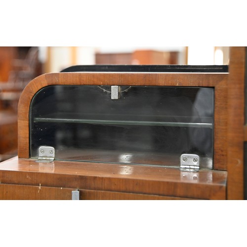 1255 - Dentistry. A rare English Art Deco walnut and ebonised  dental surgeon's cabinet, with chromium plat... 