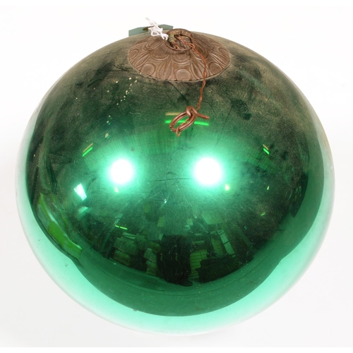 773 - A green mirrored glass witches ball, late 19th/early 20th c, 24cm diam 