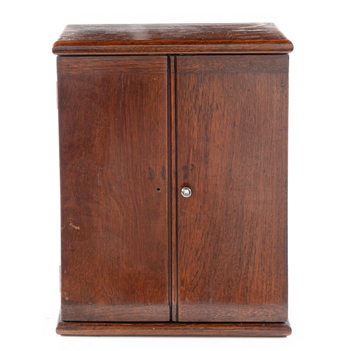 936 - A mahogany two door cupboard with fitted interior, 41cm h