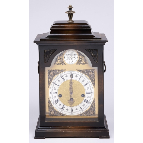 937 - A Kienzle clock in the form of an 18th c English mahogany bracket clock, late 20th c, the movement c... 