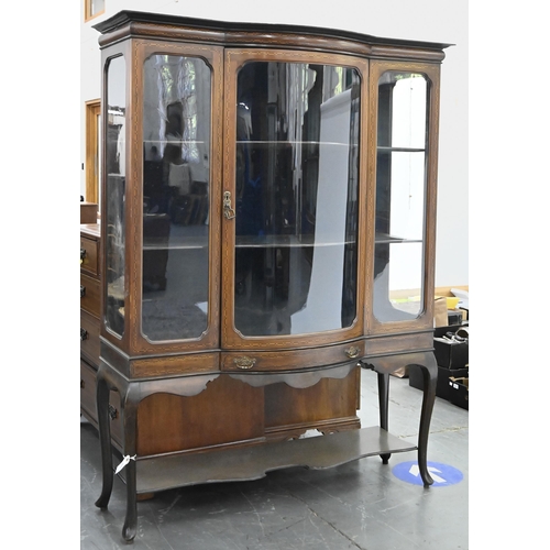 1180 - A bow centred mahogany and geometrically line inlaid china cabinet, c1910, on cabriole legs with und... 