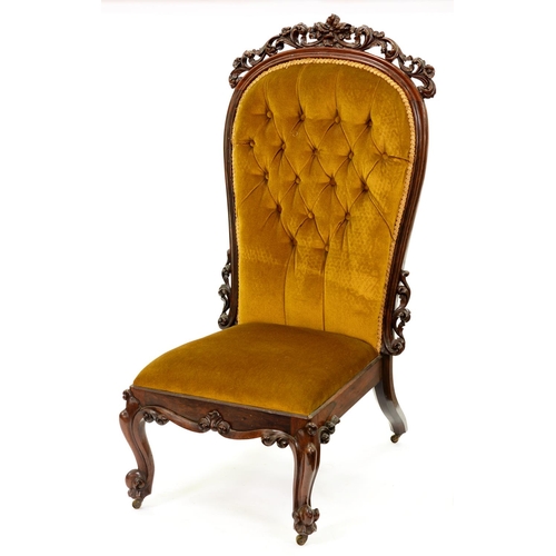 1189 - A Victorian rosewood nursing chair, the buttoned back in moulded frame with leafy scrolling crest an... 