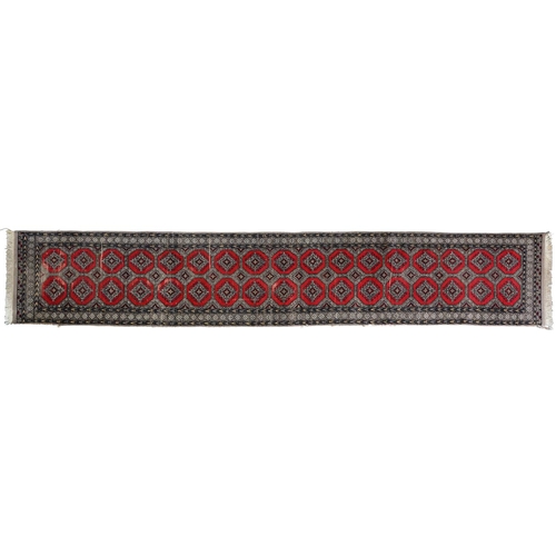 1144 - A Pakistan Bokhara runner, 81 x 448cm