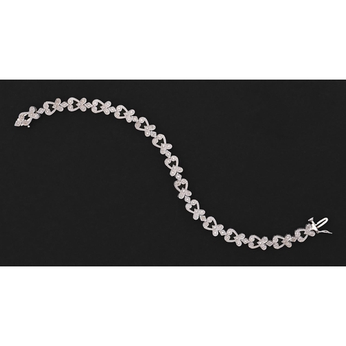 119 - A diamond bracelet, of heart shaped links, in 9ct white gold, 18.5cm, 9.7g