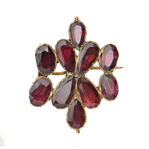 129B - A Victorian foiled garnet brooch, adapted from a necklace, in gold, 33mm, 5.4g