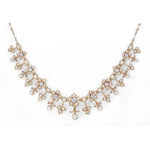 139 - A diamond and cultured pearl necklace, early 20th c, in gold, 40cm l (central section 13.5cm l), 20.... 