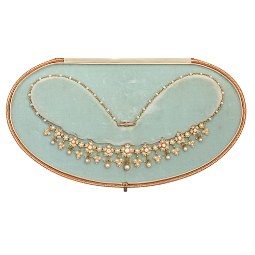 139 - A diamond and cultured pearl necklace, early 20th c, in gold, 40cm l (central section 13.5cm l), 20.... 