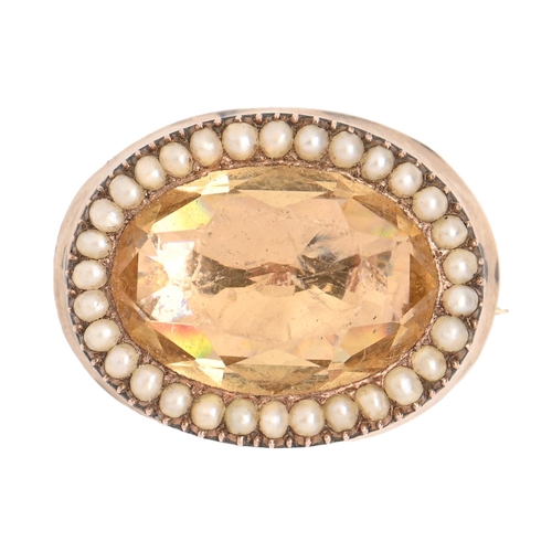 141 - A Victorian foiled oval citrine mourning brooch, mid 19th c, with split pearl surround, in gold, 20m... 