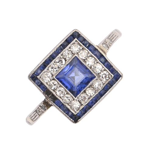 203 - A sapphire and diamond cluster ring, with larger central step cut sapphire and calibre cut sapphire ... 