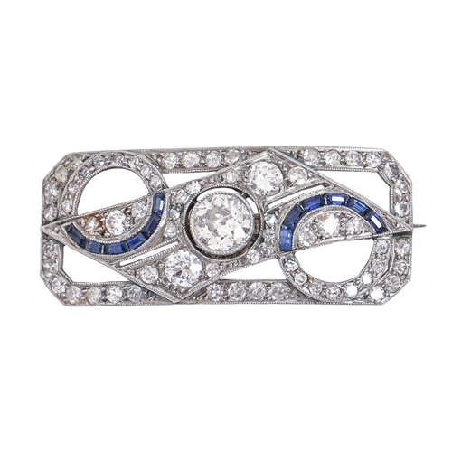 29 - An Art Deco sapphire and diamond brooch, of curved, cut-cornered rectangular shape with two half cir... 