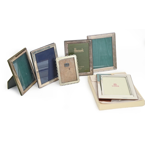 415 - Four Elizabeth II silver photograph frames, 22 x 17cm and circa, by Harrods Ltd and others, a larger... 