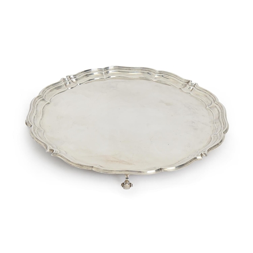 416 - A George VI silver salver, on four volute feet, 36cm diam, by Harrison Brothers and Howson, Sheffiel... 