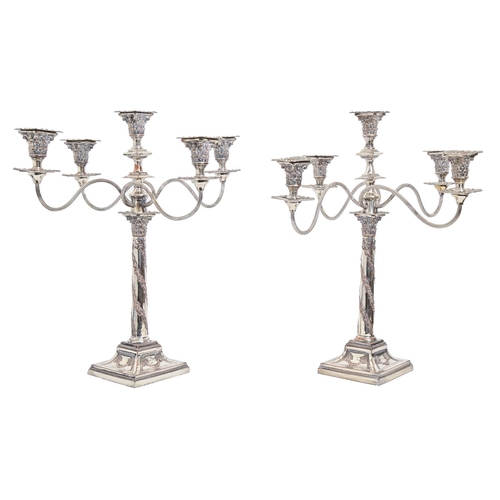 418 - A pair of EPNS candelabra, of five lights and reeded scrolling branches, the candlesticks stamped wi... 