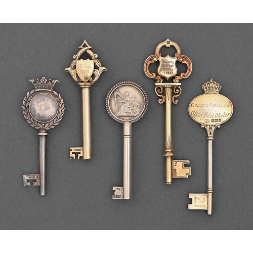 419 - Five Edwardian, George V and Elizabeth II silver and silver gilt ceremonial keys, one designed for w... 